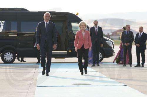 epa13092324 European Commission President Ursula von der Leyen (C) is welcomed by Turkish Minister of Culture and Tourism, Mehmet Nuri Ersoy (L), at Esenboga Airport ahead of the 36th NATO Heads of State and Government Summit in Ankara, Turkiye, 06 July 2026. The summit will take place on 07–08 July, focusing on strengthening defense industrial production...