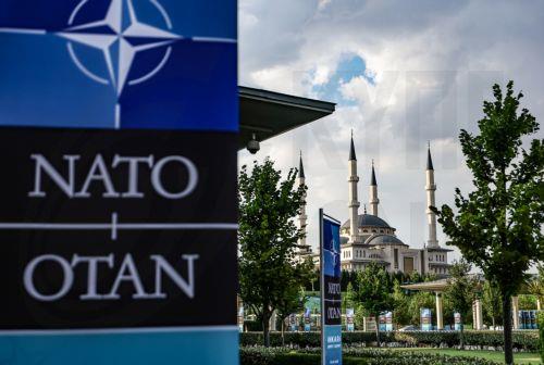 epa13092354 NATO banners near the Millet Mosque ahead of the NATO Summit 2026 in Ankara, Turkey, 06 July 2026. The summit will take place on 07–08 July, focusing on strengthening defense industrial production and securing long-term military aid for Ukraine.  EPA/FILIP SINGER