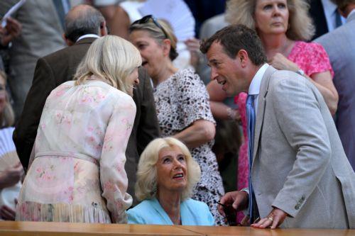 epa13098271 Britain's Queen Camilla (C) speaks with Peter Phillips (R) and Deborah Jevans (L)  in the royal box at centre court at the Wimbledon Championships in London, Britain, 08 July 2026.  EPA/DANIEL HAMBURY
