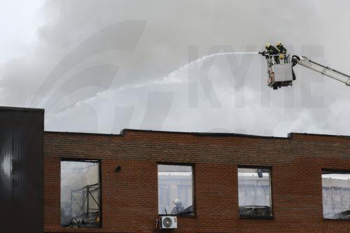 epa13098292 Ukrainian rescuers work at the site of a Russian drone strike on a building in Kyiv, Ukraine, 08 July 2026, amid the Russian invasion. The State Emergency Service of Ukraine reported that at least two people were killed, and several injured, as a result of the Russian attack on a storage facility.  EPA/SERGEY DOLZHENKO