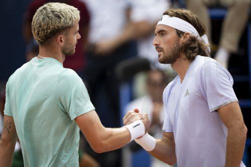 epa13115242 Stefanos Tsitsipas (R) of Greece celebrates after winning his Round of 16 match against Jerome Kym (L) of Switzerland at the Swiss Open tennis tournament in Gstaad, Switzerland, 16 July 2026.  EPA/ANTHONY ANEX
