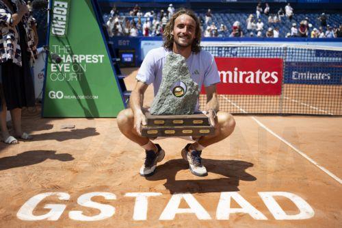 epa13120278 Stefanos Tsitsipas of Greece poses with the trophy after his victory in the men's final match against Raphael Collignon of Belgium at the Swiss Open tennis tournament in Gstaad, Switzerland, 19 July 2026.  EPA/ANTHONY ANEX