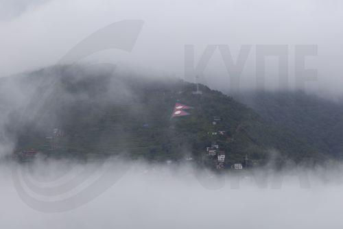epa13124219 Monsoon clouds drift over the hills surrounding Kathmandu, Nepal, 21 July 2026. Nepal's Meteorological Forecasting Division has announced that the monsoon season has officially begun across the country.  EPA/NARENDRA SHRESTHA