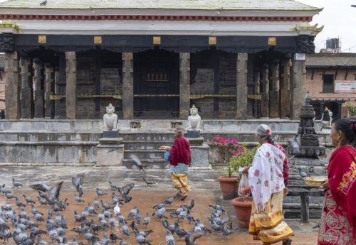 epa13124222 Elderly women visit the Bungamati Temple in Bungamati on the outskirts of Kathmandu, Nepal, 21 July 2026. Nepal's Meteorological Forecasting Division has announced that the monsoon season has officially begun across the country.  EPA/NARENDRA SHRESTHA