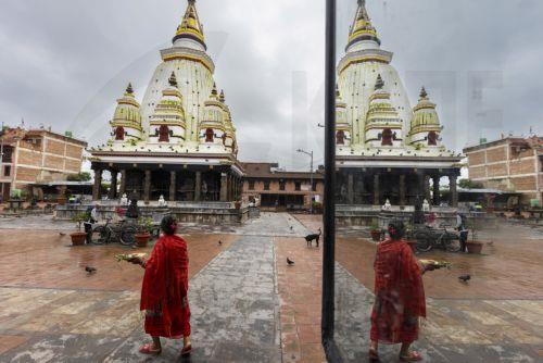 epa13124224 Elderly women visit the Bungamati Temple in Bungamati on the outskirts of Kathmandu, Nepal, 21 July 2026. Nepal's Meteorological Forecasting Division has announced that the monsoon season has officially begun across the country.  EPA/NARENDRA SHRESTHA