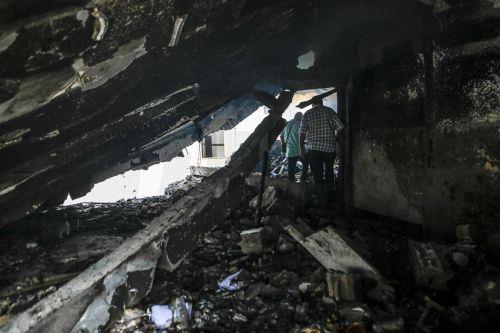epa13124383 Palestinians inspect the destroyed house of the Al-Masri family following an Israeli attack, in Gaza City, Gaza Strip, 21 July 2026. Firas Al-Masri, his wife, Salsabil, and their four children were killed in Gaza City, when the Israeli army targeted their home with a drone early 21 July, according to the Gaza Ministry of Health.  EPA/MOHAMMED...