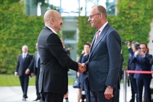 epa13124388 German Chancellor Friedrich Merz (R) welcomes Azerbaijani President Ilham Aliyev with military honors at the Chancellery in Berlin, Germany, 21 July 2026. Merz and Aliyev met for bilateral talks.  EPA/CLEMENS BILAN