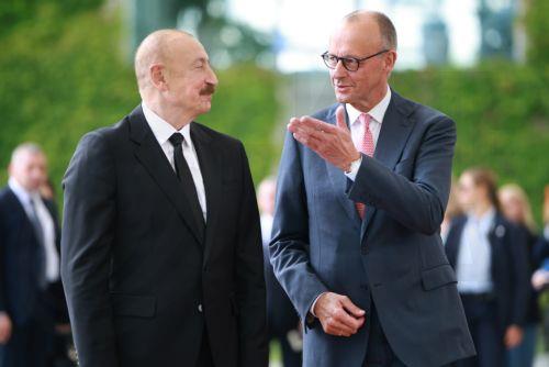 epa13124392 German Chancellor Friedrich Merz (R) welcomes Azerbaijani President Ilham Aliyev with military honors at the Chancellery in Berlin, Germany, 21 July 2026. Merz and Aliyev met for bilateral talks.  EPA/CLEMENS BILAN