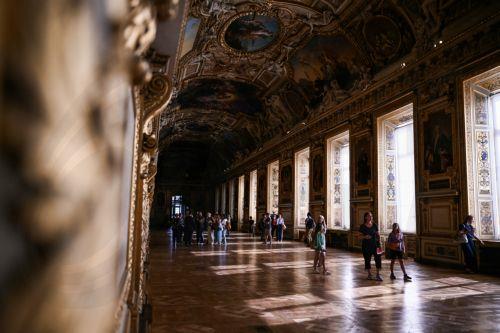 epa13125933 Visitors walk in the Apollo Gallery during its reopening at the Louvre Museum in Paris, France, 22 July 2026, after a heist in October 2025 in which French crown jewels were stolen.  EPA/LOU BENOIST / POOL  MAXPPP OUT