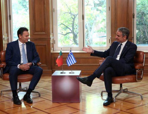 epa13126120 Greek Prime Minister Kyriakos Mitsotakis (R) speaks with Portuguese Prime Minister Luis Montenegro (L) during their meeting at the Maximos Mansion in Athens, Greece, 22 July 2026. Montenegro is in Athens for a bilateral working meeting with his Greek counterpart.  EPA/ORESTIS PANAGIOTOU