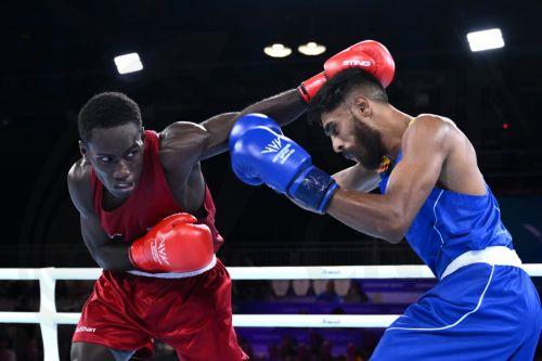epa13132981 Max Makana (L) of Solomon Islands fights Ravindu Jayantha of Sri Lanka during the Men's 60kg Round of 32 match on day two of the Glasgow 2026 Commonwealth Games at the SEC Centre in Glasgow, Scotland, 25 July 2026.  EPA/JOEL CARRETT AUSTRALIA AND NEW ZEALAND OUT