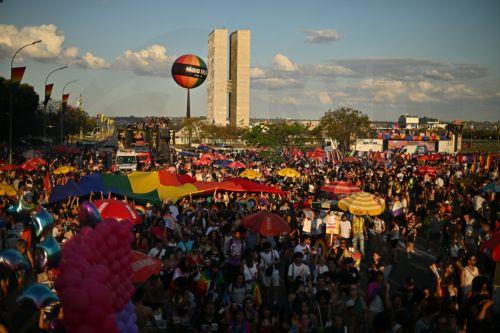 epa13134932 People participate in the LGBT Pride march on the Esplanade of the Ministries in Brasilia, Brazil, 26 July 2026.  EPA/Andre Borges