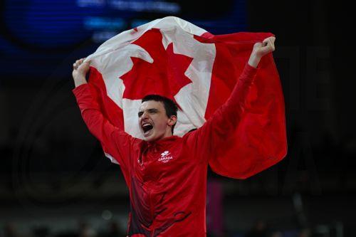epa13135802 Jordan Carroll of Canada celebrates after winning the Artistic Gymnastics Men’s Pommel Horse Final during the Glasgow 2026 Commonwealth Games at the Glasgow International Arena in Glasgow, Britain, 27 July 2026.  EPA/LUKAS COCH AUSTRALIA AND NEW ZEALAND OUT