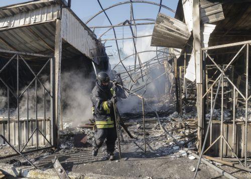 epa13141168 Ukrainian rescuers work at the site of a Russian missile strike on a market in Kyiv, Ukraine, 30 July 2026, amid the Russian invasion. At least eight people died, and dozens of people were injured after an overnight massive combined Russian attack in Ukraine, according to the State Emergency Service. Russia launched at least 70 missiles of...