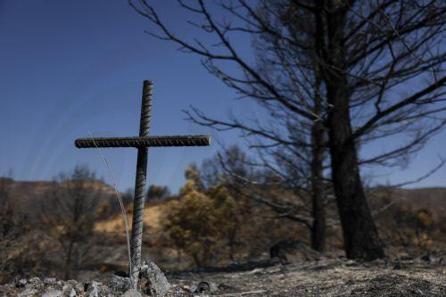 epa13141269 Burnt land following a wildfire at La Vall d'Uixo, Castellon, Spain, 30 July 2026. The fire, which was declared on 25 July 2026, is still not under control and has already burned 9,300 hectares, with a perimeter of 84 kilometers.  EPA/KAI FOERSTERLING