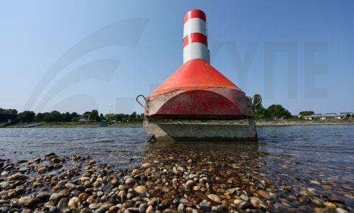 epa13141323 A buoy used to mark the waterway on the Rhine river is sitting on dry land in Speyer, Germany, 30 July 2026. Due to a severe heatwave and prolonged dry weather, water levels on the Rhine River in Germany have plunged. The German Weather Service (DWD) expects the heat wave to peak in the coming days, with temperatures between 34 and 38 degrees...