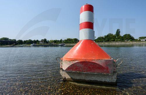 epa13141325 A buoy used to mark the waterway on the Rhine river is sitting on dry land in Speyer, Germany, 30 July 2026. Due to a severe heatwave and prolonged dry weather, water levels on the Rhine River in Germany have plunged. The German Weather Service (DWD) expects the heat wave to peak in the coming days, with temperatures between 34 and 38 degrees...