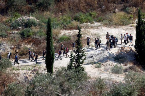 epa13143498 Israeli settlers enter the village of Sara, near the West Bank city of Nablus, 31 July 2026. According to the Palestinian news agency WAFA, a Palestinian man was injured when Israeli soldiers fired live bullets at a group of Palestinians in the Al Jouned area, as dozens of Israeli settlers marched through the Palestinian city of Nablus early 31...