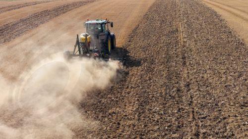 epa13148028 A drone picture shows a tractor cultivating a harvested field while sowing a cover crop amid extremely dry conditions near Gembloux, Belgium, 03 August 2026. Belgium is under an orange heat warning issued by the Royal Meteorological Institute (RMI/IRM), with temperatures expected to reach up to 36 degrees Celsius, as much of the country...