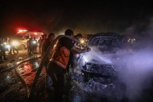 epa13149116 Palestinian Civil Defense personnel extinguish a fire in a destroyed car following an Israeli airstrike on Al-Rashid Road next to the beach in southern Gaza City, 03 August 2026. According to the Gaza Health Ministry, two Palestinians were killed in the strike.  EPA/MOHAMMED SABER