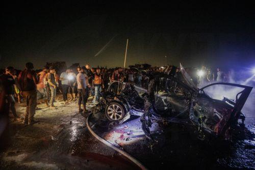 epa13149118 Palestinian Civil Defense personnel extinguish a fire in a destroyed car following an Israeli airstrike on Al-Rashid Road next to the beach in southern Gaza City, 03 August 2026. According to the Gaza Health Ministry, two Palestinians were killed in the strike.  EPA/MOHAMMED SABER