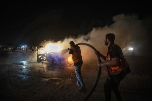 epaselect epa13149077 Palestinian Civil Defense personnel extinguish a fire in a destroyed car following an Israeli airstrike on Al-Rashid Road next to the beach in southern Gaza City, 03 August 2026. According to the Gaza Health Ministry, two Palestinians were killed in the strike.  EPA/MOHAMMED SABER