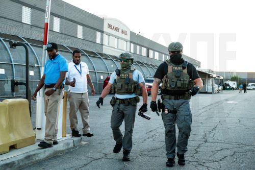 epa13149175 Immigration and Customs Enforcement (ICE) agents are seen with a can of pepper spray at the Delaney Hall Immigration Detention Facility during a vigil and protest for Edwin Jovanny Lopez Cornejo, in Newark, New Jersey, USA, 03 August 2026. At least 54 people have died in ICE custody since the start of the second Trump administration.  EPA/OLGA...