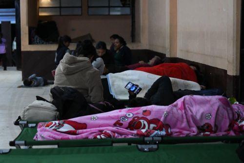 epa13149910 People rest after being evacuated in Alotenango, southwest of Guatemala City, Guatemala, 04 August 2026. The National Coordinator for Disaster Reduction (CONRED) reported that at least two villages on the slopes of the Fuego volcano, El Porvenir and Las Lajitas, were evacuated.  EPA/ALEX CRUZ