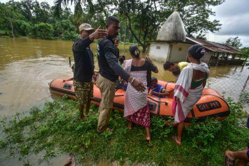 epa13151282 State Disaster Response Fund (SDRF) personnel rescue residents from a flooded area following heavy monsoon rains in Kalapani village, Nagaon district, Assam, India, 05 August 2026. According to the Assam State Disaster Management Authority (ASDMA), the death toll from severe flooding in the north-eastern state of Assam has risen to 89, with over...