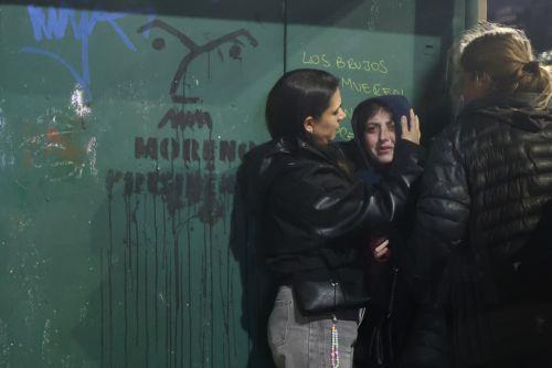 epa13154751 A woman is comforted during a clash between protesters and police officers at a demonstration against a bill promoted by the government of President Javier Milei introducing changes to eviction procedures, expropriations, and the use of burned land, in Buenos Aires, Argentina, 06 August 2026.  EPA/Juan Ignacio Roncoroni