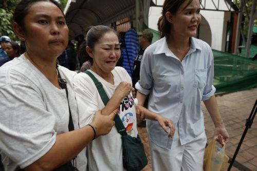epa13155061 A relative (C) of a teacher killed in a school shooting is assisted after identifying the body at Debsirin Nonthaburi School in Bang Kruai district, Nonthaburi province, Thailand, 07 August 2026. Seven people were killed and 15 injured after a student opened fire inside the school campus, according to a Royal Thai Police spokesperson. ...