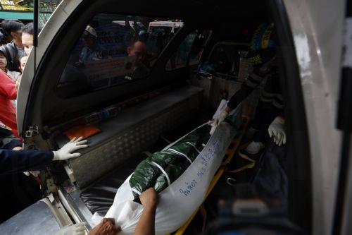 epa13155064 The body of victim of a school shooting is placed in a van at Debsirin Nonthaburi School in Bang Kruai district, Nonthaburi province, Thailand, 07 August 2026. Seven people were killed and 15 injured after a student opened fire inside the school campus, according to a Royal Thai Police spokesperson.  EPA/RUNGROJ YONGRIT