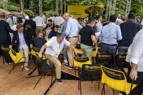 epa13155281 Guests react as the floor of the podium collapses at the Fondazione Monte Verita on the sideline of the 79th Locarno Film Festival, in Ascona near Locarno, Switzerland, 07 August 2026. The event's 79th edition runs from 05 to 15 August 2026.  EPA/JEAN-CHRISTOPHE BOTT    EDITORIAL USE ONLY