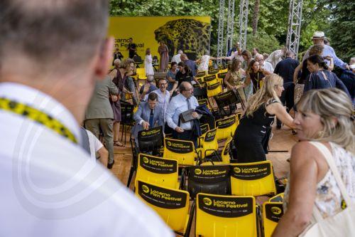 epa13155311 Guests react as the floor of the podium collapses at the Fondazione Monte Verita on the sideline of the 79th Locarno Film Festival, in Ascona near Locarno, Switzerland, 07 August 2026. The event's 79th edition runs from 05 to 15 August 2026.  EPA/JEAN-CHRISTOPHE BOTT   EDITORIAL USE ONLY