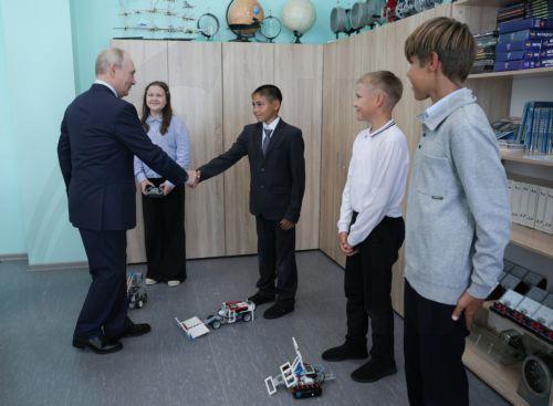 epa13166339 Russian President Vladimir Putin (L) visits the secondary school named after Hero of Russia Eduard Norpolov in Kurilsk, Sakhalin region, Russia, 13 August 2026.  EPA/GAVRIIL GRIGOROV / SPUTNIK / KREMLIN POOL MANDATORY CREDIT