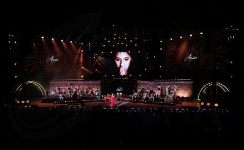 epa13176464 Tunisian singer Amina Fakhet performs during the 60th edition of the Carthage International Festival at the Roman Theatre of Carthage in Tunis, Tunisia, 17 August 2026. The festival runs from 16 July to 19 August 2026.  EPA/MOHAMED MESSARA