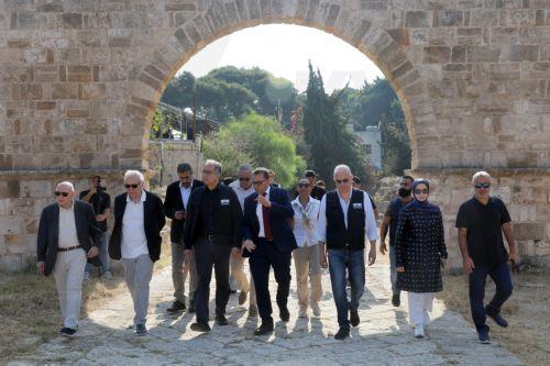 epa13180357 Lebanese Culture Minister Ghassan Salame (2-L) and UNESCO Director General Khaled El-Enany (3-L) during their visit to the al-Bass ruins district in Tyre, southern Lebanon, 20 August 2026. Israeli air strikes have hit areas in the ruins district and near the ancient Roman hippodrome during the conflict between Israel and Hezbollah, destroying...