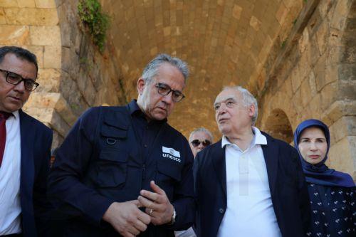 epa13180365 Lebanese Culture Minister Ghassan Salame (2-R) and UNESCO Director General Khaled El-Enany (2-L) during their visit to the al-Bass ruins district in Tyre, southern Lebanon, 20 August 2026. Israeli air strikes have hit areas in the ruins district and near the ancient Roman hippodrome during the conflict between Israel and Hezbollah, destroying...