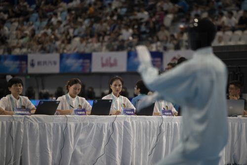 epa13186087 A humanoid robot takes part in the Tai Chi event during the 2026 World Humanoid Robot Games at the National Speed Skating Oval in Beijing, China, 23 August 2026. The 2026 World Humanoid Robot Games are being held in Beijing until 26 August.  EPA/ANDRES MARTINEZ CASARES