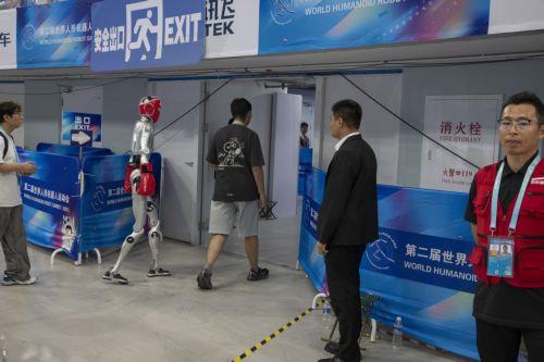 epa13186089 A humanoid robot is driven outside of the field after taking part in a fighting event during the 2026 World Humanoid Robot Games at the National Speed Skating Oval in Beijing, China, 23 August, 2026. The 2026 World Humanoid Robot Games are being held in Beijing until 26 August.  EPA/ANDRES MARTINEZ CASARES