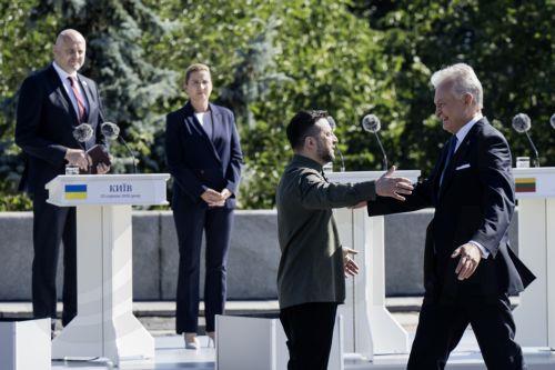 epa13186123 Ukrainian President Volodymyr Zelensky welcomes Lithuania's President Gitanas Nauseda (R) to the ceremony of the National Flag raising in Kyiv, Ukraine, 23 August 2026, amid the ongoing Russian invasion. Ukraine celebrates the National Flag Day on 23 August every year.  EPA/Maxym Marusenko