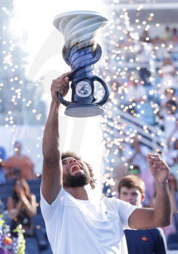 epaselect epa13187734 Arthur Fils of France holds up the Rookwood Trophy after defeating Frances Tiafoe of the USA after their final match of the Cincinnati Open tennis tournament in Cincinnati, Ohio, USA, 23 August 2026.  EPA/MARK LYONS
