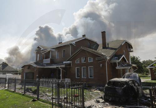 epa13194383 Cars are burnt and a house is damaged at the site of a Russian strike on private buildings near Kyiv, Ukraine, 27 August 2026, amid the Russian invasion. After the overnight Russian combined shelling, Ukrainian rescuers are working at 9 locations. Among them are private homes, warehouses, and fire outbreaks in ecosystems, according to the...