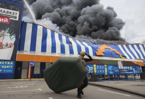 epa13196223 A Ukrainian rescuer works at the site of a Russian drone strike on a shopping mall in Zaporizhzhia, Ukraine, 28 August 2026, amid the Russian invasion. At least four people were injured in a Russian attack on a construction hypermarket in Zaporizhzhia, according to the Ukrainian State Emergency Service (SES).  EPA/OLEG MOVCHANIUK
