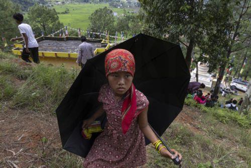 epa13196536 A girl makes her way on a higher ground following another flash flood alert in Nuwakot district, Nepal, 28 August 2026. More than 460 people have died and hundreds remain missing across northern Nepal after a suspected avalanche triggered massive flash floods and mudslides along the Bhotekoshi and Trishuli river near the Nepal-Tibet border,...