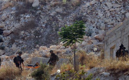 epa13196973 Israeli troops carry the bodies of three Palestinians killed in an airstrike near the West Bank city of Jenin, 28 August 2026. Israel's military reported it conducted a strike against several militants in the Jenin area.  EPA/ALAA BADARNEH