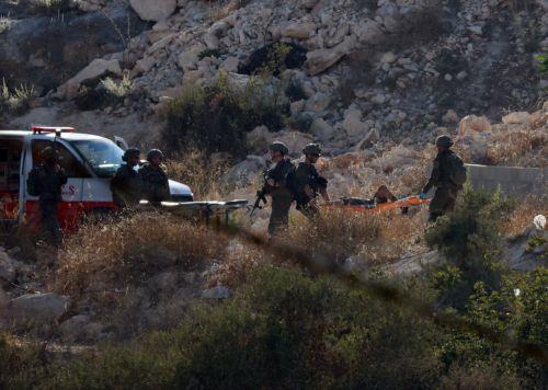 epa13196974 Israeli troops carry the bodies of three Palestinians killed in an airstrike near the West Bank city of Jenin, 28 August 2026. Israel's military reported it conducted a strike against several militants in the Jenin area.  EPA/ALAA BADARNEH