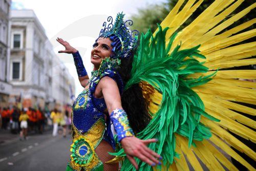 epa13202247 Costumed participants perform during the Notting Hill Carnival adults' parade in London, Britain, 31 August 2026. The carnival, marking its 60th year, is Europe's largest street carnival, celebrating Caribbean history and culture, and runs from 30 August to 31 August 2026.  EPA/TOLGA AKMEN