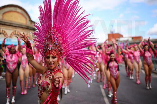 epa13202250 Costumed participants perform during the Notting Hill Carnival adults' parade in London, Britain, 31 August 2026. The carnival, marking its 60th year, is Europe's largest street carnival, celebrating Caribbean history and culture, and runs from 30 August to 31 August 2026.  EPA/TOLGA AKMEN