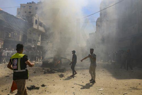 epa13202347 Palestinians inspect a destroyed car following an Israeli air strike on Gaza City, 31 August 2026. According to reports by the Ministry of Health in Gaza, at least three Palestinians were killed in the Israeli attack.  EPA/MOHAMMED SABER